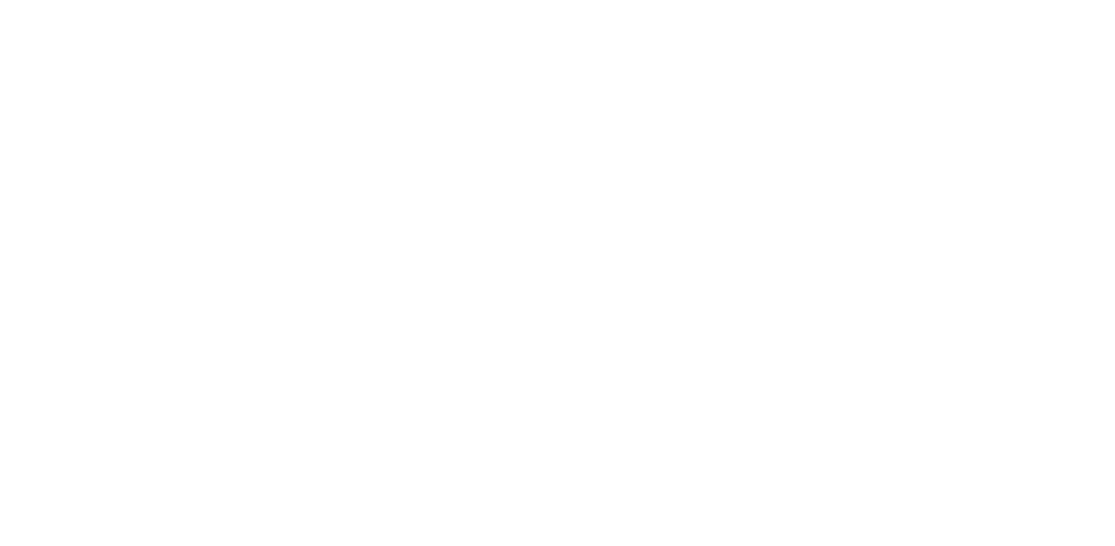 Dwie kobiety w nowoczesnej odzieży medycznej rozmawiające w poczekalni kliniki.