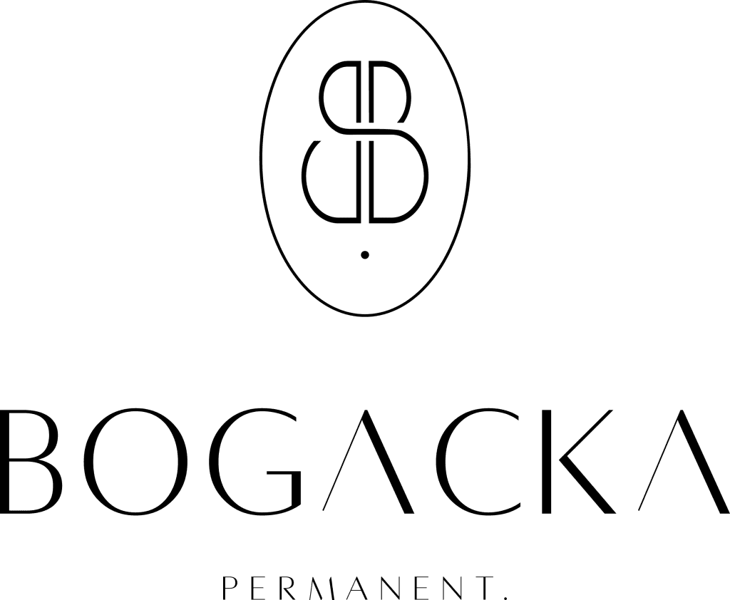 Lekarz i pielęgniarka w nowoczesnej odzieży medycznej rozmawiający w sali szpitalnej.