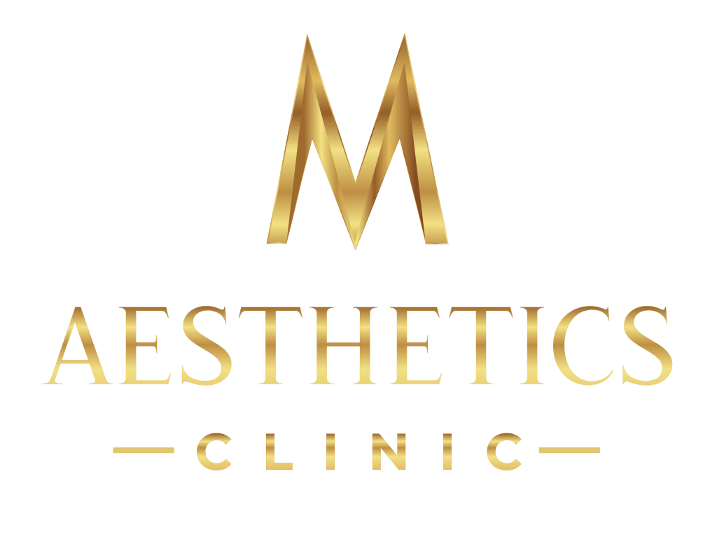 Złote logo kliniki estetycznej na czarnym tle